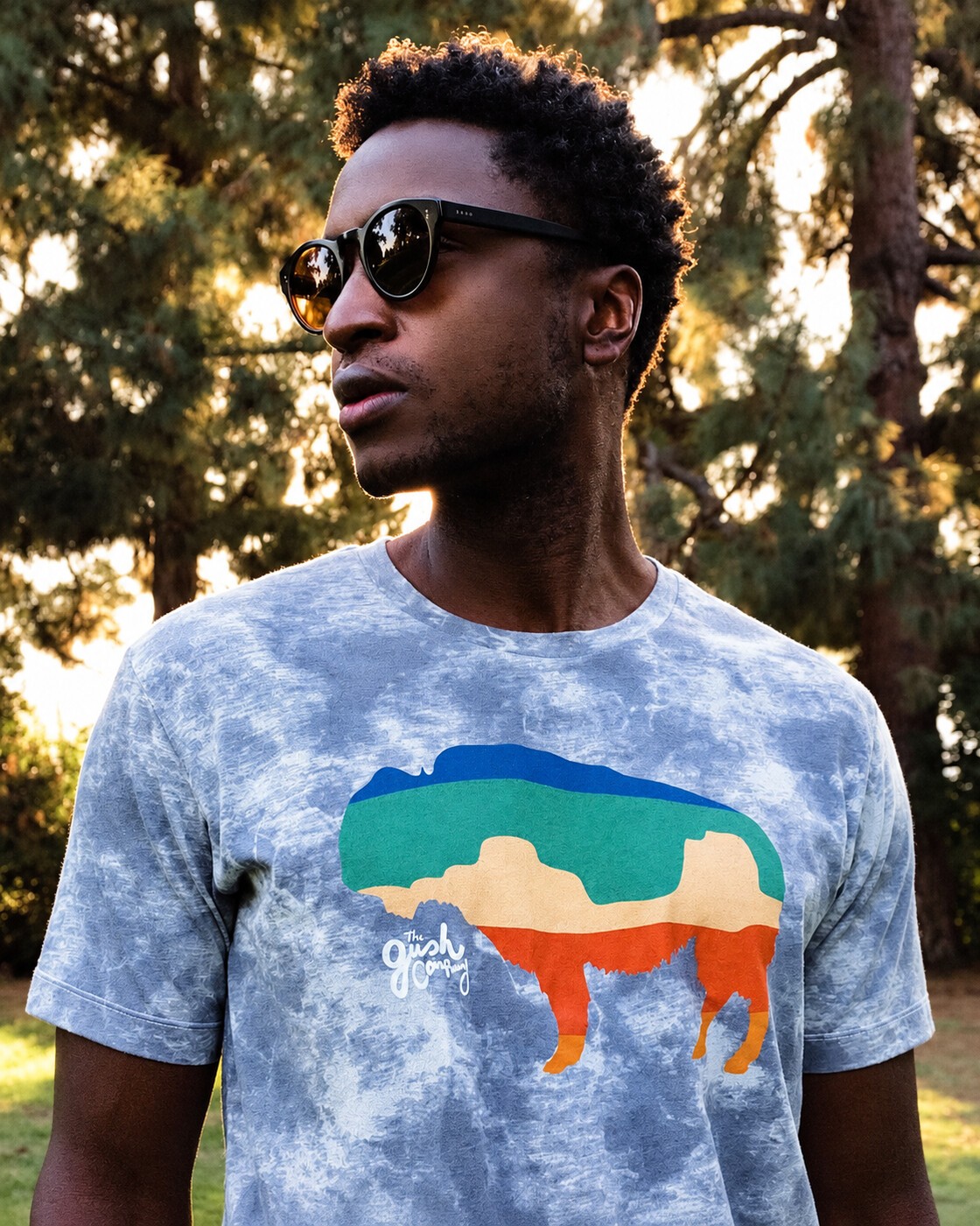 Buffalo tee portrait beneath the trees