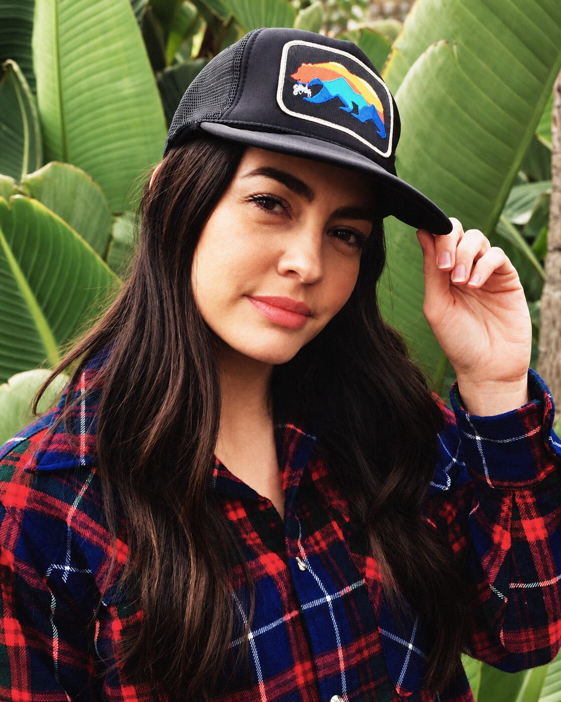 Bear hat portrait among tropical foliage