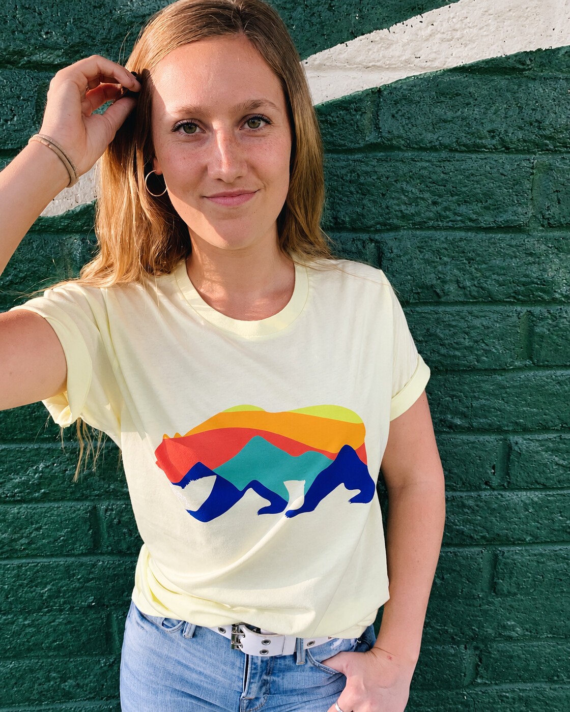 Bear tee portrait against a green wall